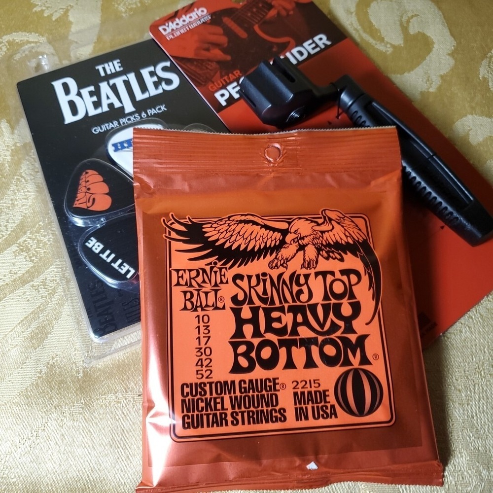 Ernie Ball D'Addario Guitar Accessory Bundle Strings Picks Peg Winder Kit